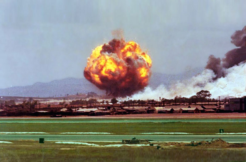1. Da Nang AB: 366th TFW: From the flightline, the grassfire is out of control and bombs are cooking off west of the runway's 4K marker. April 27-1969. [Peter Halferty photo]. 