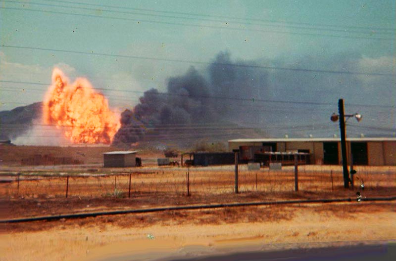 2. Da Nang AB: 366th TFW: I left my position on airfield and went to the end of runway and crossed over to the other side near the ASP. I was not a full sand wedge from the whole enchallida. So it blew napalm. Note background: Hill 357. April 27-1969. [Peter Halferty photo].
