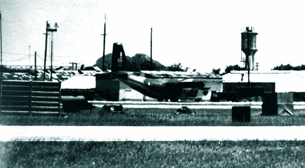 8. Da Nang AB, 366th TFW: C-130 rolling on taxiway toward south end of runway. 1969-1970. [Photo by Ed Burchard].