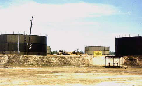 18. Da Nang AB, 366th TFW: Nearby POL Tank Farm survives with the are rocket cratered. 1969-1970. [Photo by Ed Burchard].