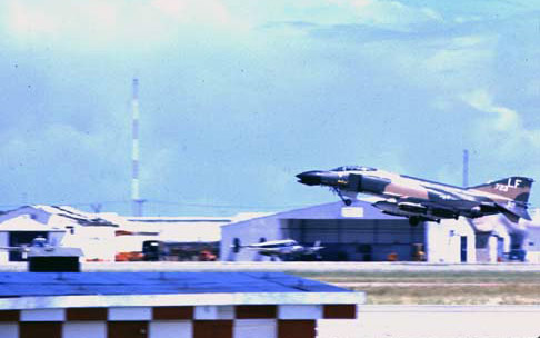 76. Da Nang AB, 366th TFW:Morning F-4 Phantom catapults off runway. 1969-1970. [Photo by Ed Burchard].