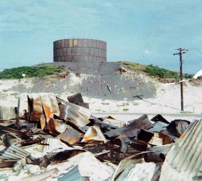 17. Cam Ranh Bay AB: US Army 6th Convalescent Hospital debris by Sapper Attack! 1969. [Peter Halferty photo].
Photos 17, 18, and 19: This is the 6th Convalescent hospital at Cam Ranh Bay AB, SVN. In August 1969 sappers attacked the US Army hospital compound. First reports were 98 dead and 2 wounded. Later changed to 2 dead and 57 wounded. I worked all night and heard all the sirens and blast and went to the hosiptal in the morning when I got off work. The entire hospital was mostly wiped out. Quonset huts were destroyed.