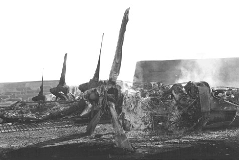 Remains of 2 C-130s, destroyed by Sappers, July 1, 1965, Da Nang Air Base.