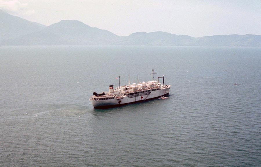 Da Nang Harbor. USS Repose, hospital ship, getting underway as boat moves away from ship.