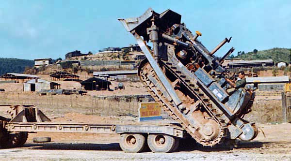 Jay Gearhart, making a Touchdown Landing with a caterpillar tractor. Miss America 1969, Judith Anne Ford 1969 and Court.